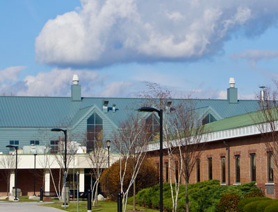 Series 300 Metal Roofing Seen on Original Campus Building and the New Expansion Built Two Decades Later Series 300 Metal Roofing Seen on Original Campus Building and the New Expansion Built Two Decades Later