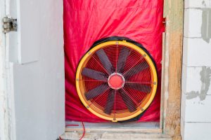 Testing the house for airtightness, on the front door installed a powerful fan